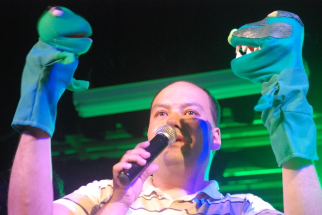 Figure 2: One of the Members Performing on Stage with Puppets He Created.